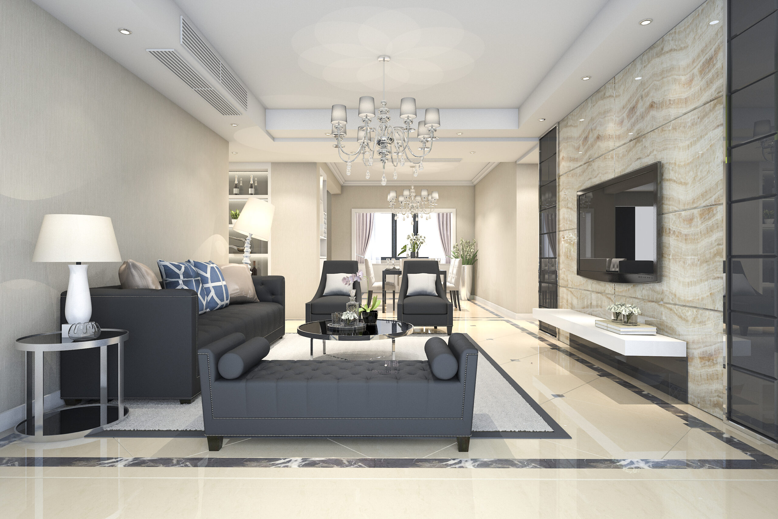 Salotto con divani scuri, lampadario di cristallo e dettagli eleganti caratterizzanti l'arredamento classico.